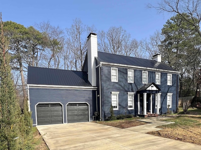 colonial home with a garage