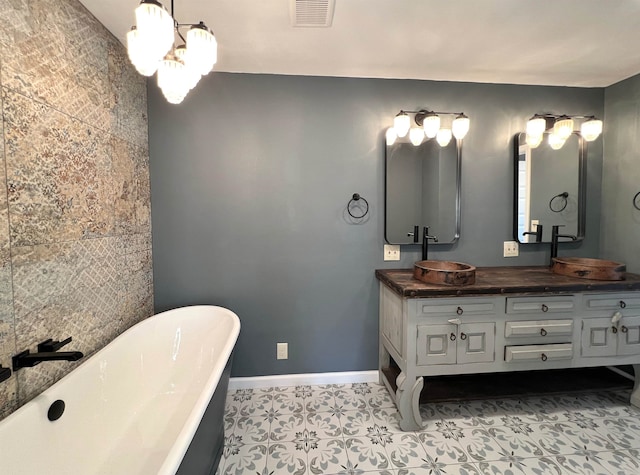 bathroom featuring vanity and a bath