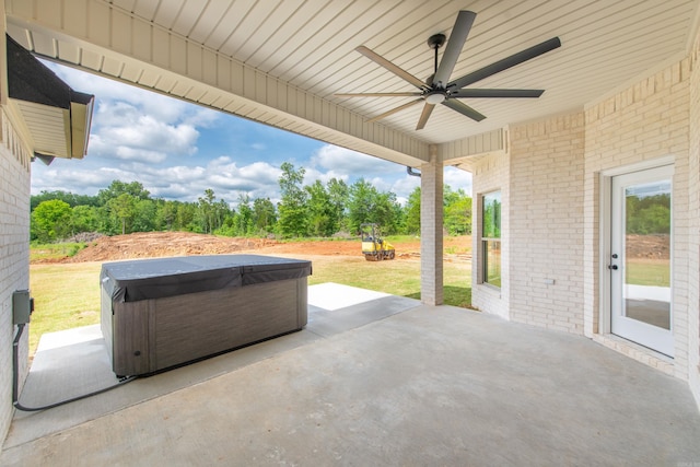 view of patio featuring a hot tub and ceiling fan