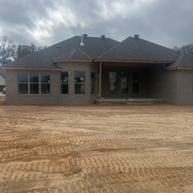 rear view of property featuring a patio area