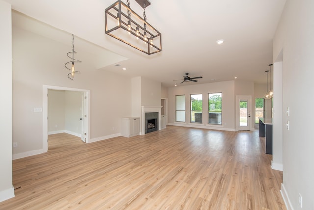 unfurnished living room featuring light hardwood / wood-style floors and ceiling fan