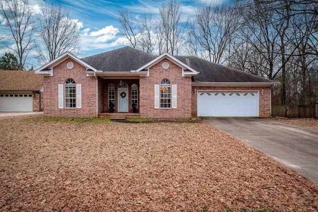 ranch-style home featuring a garage