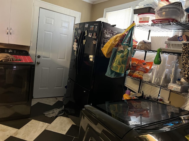 laundry area featuring washer and dryer and cabinets