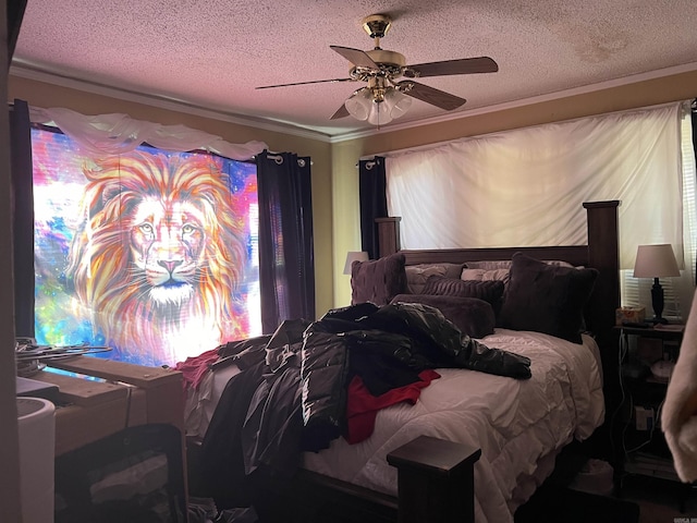 bedroom with ceiling fan, ornamental molding, and a textured ceiling