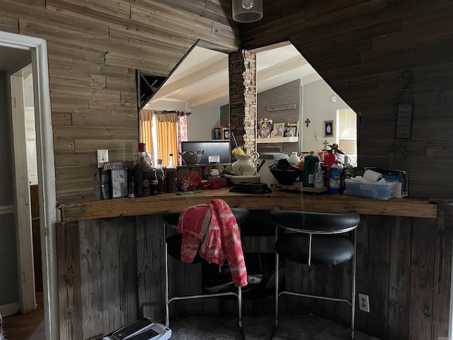 bar featuring lofted ceiling