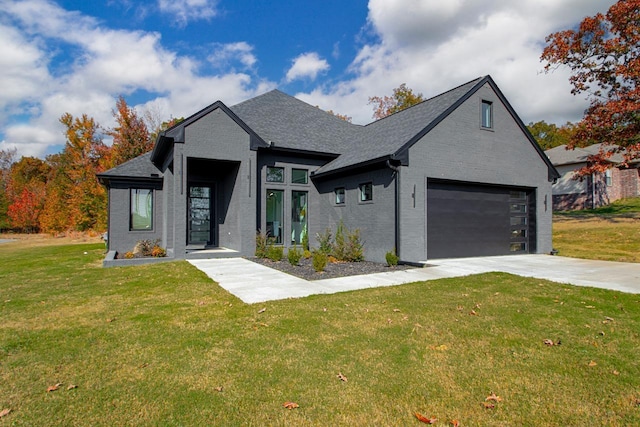 view of front of home with a garage and a front yard