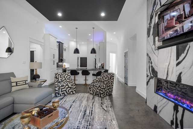 living room featuring a high ceiling