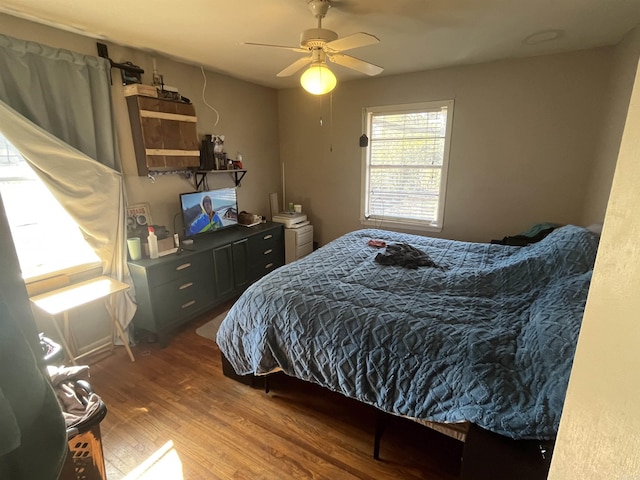 bedroom with hardwood / wood-style flooring and ceiling fan