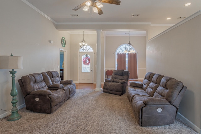 living room with decorative columns, crown molding, and carpet floors