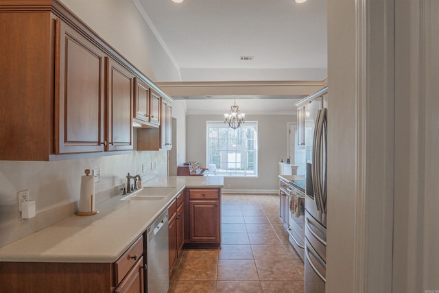 kitchen featuring appliances with stainless steel finishes, sink, tile patterned flooring, kitchen peninsula, and crown molding