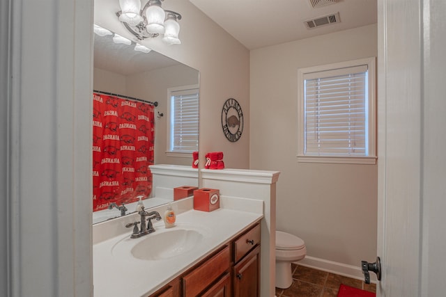 bathroom with vanity and toilet