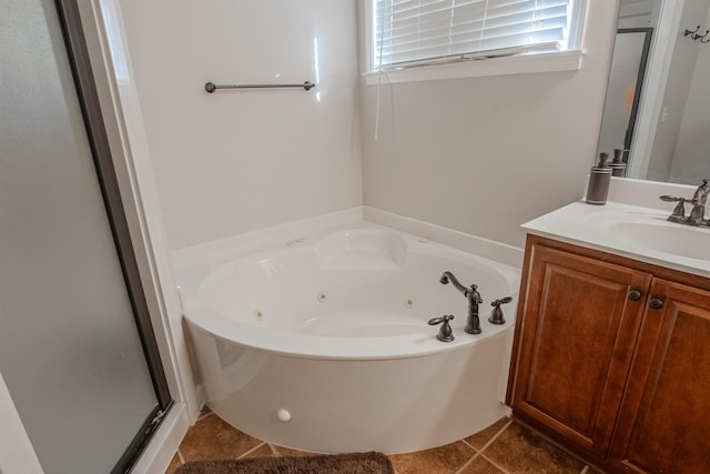 bathroom featuring vanity, shower with separate bathtub, and tile patterned floors