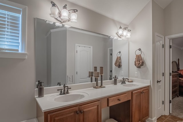 bathroom with vanity and a notable chandelier