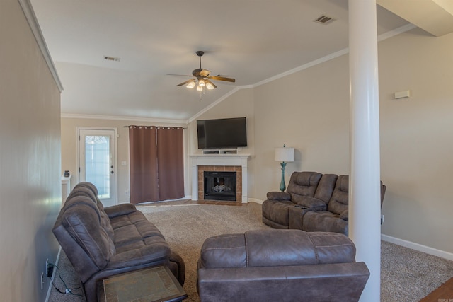 carpeted living room featuring crown molding, a fireplace, ceiling fan, and vaulted ceiling