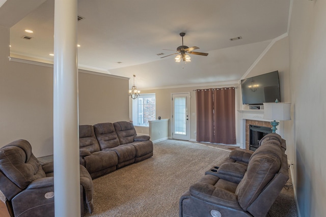 living room with a tile fireplace, lofted ceiling, carpet floors, ornamental molding, and ceiling fan