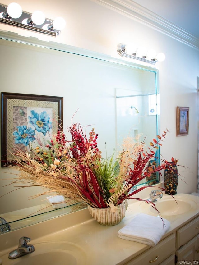 bathroom with ornamental molding and vanity