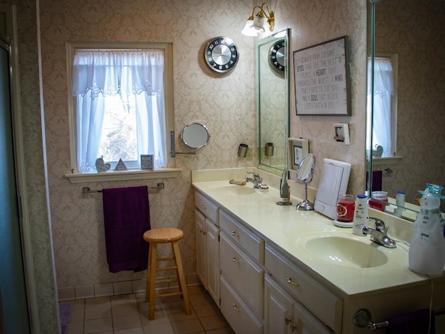 bathroom with tile patterned flooring and vanity