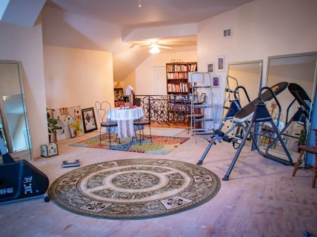 exercise room with ceiling fan and light hardwood / wood-style flooring