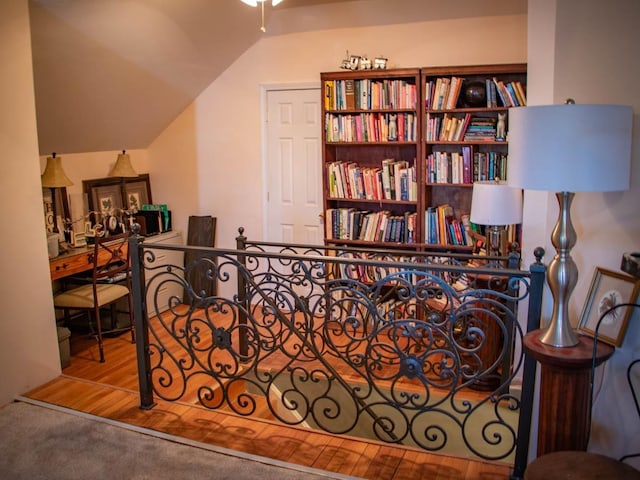 interior space with lofted ceiling and carpet flooring