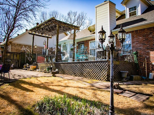 exterior space with a wooden deck, a yard, and a patio area