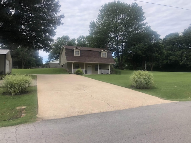 view of front of home featuring covered porch and a front lawn