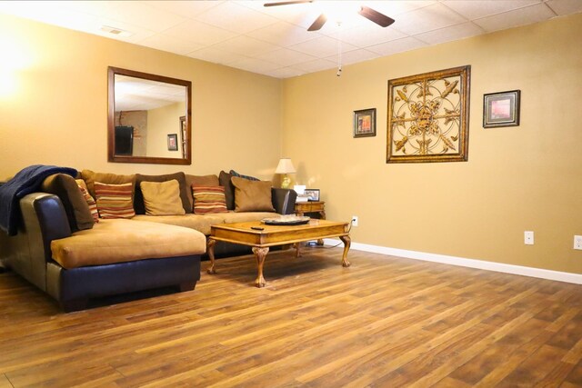 living room featuring hardwood / wood-style flooring and ceiling fan