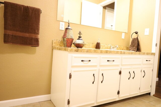 bathroom with vanity and tile patterned flooring