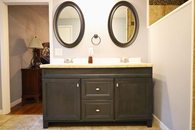 bathroom with vanity and tile patterned flooring