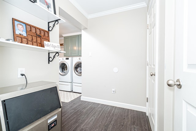 washroom featuring cabinets, crown molding, dark wood-type flooring, and independent washer and dryer