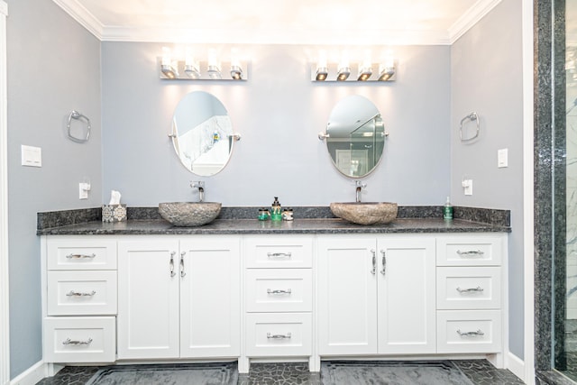 bathroom featuring ornamental molding, a shower with door, and vanity