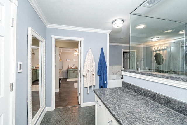 bathroom with vanity and crown molding