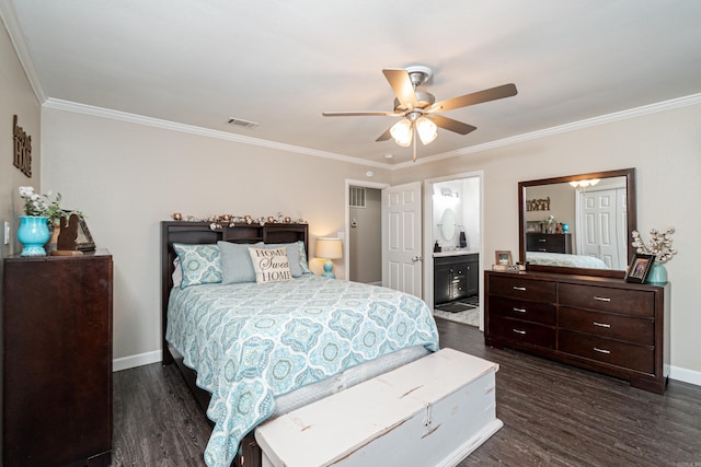 bedroom featuring connected bathroom, crown molding, dark wood-type flooring, and ceiling fan