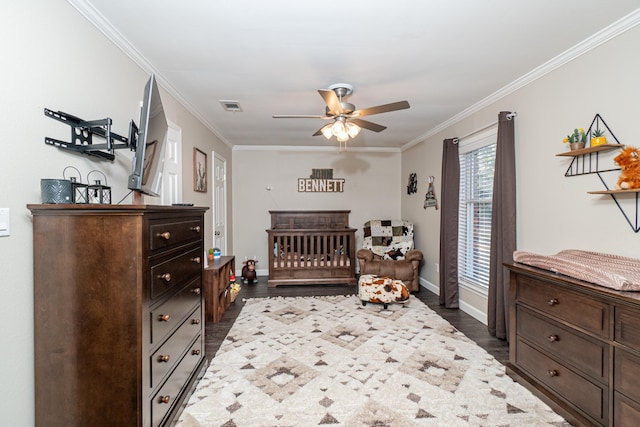 bedroom featuring crown molding and dark wood-type flooring