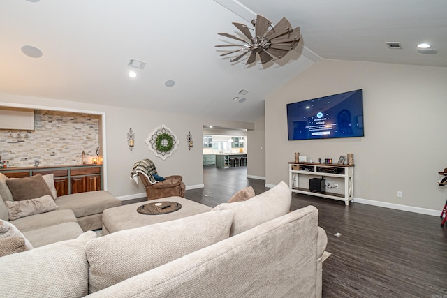 living room with dark hardwood / wood-style flooring and lofted ceiling