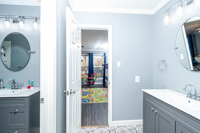 bathroom featuring ornamental molding and vanity