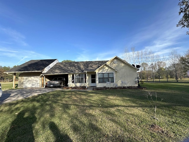 ranch-style house featuring a front lawn and a carport