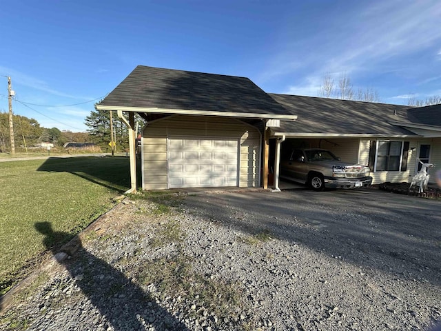 exterior space featuring a lawn and a carport