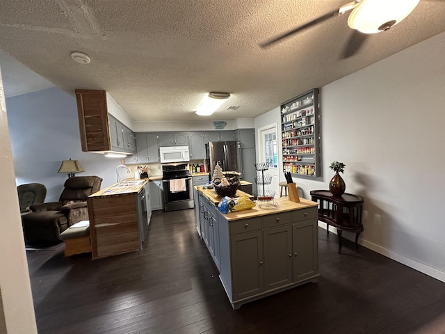 kitchen featuring gray cabinets, electric range oven, dark hardwood / wood-style floors, and stainless steel fridge with ice dispenser