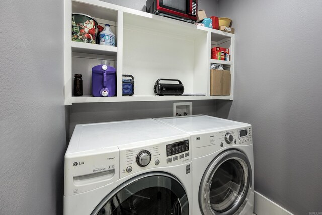 washroom featuring washing machine and dryer