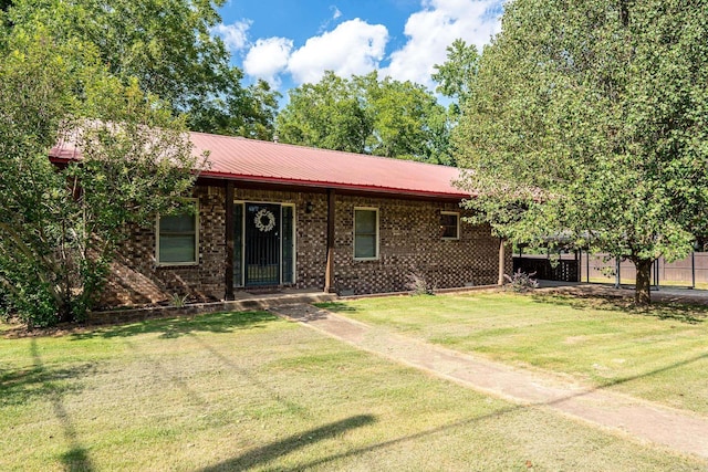 ranch-style house featuring a front lawn