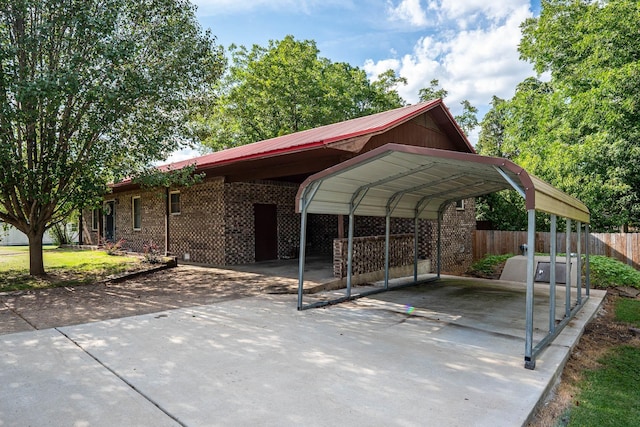 view of vehicle parking with a carport