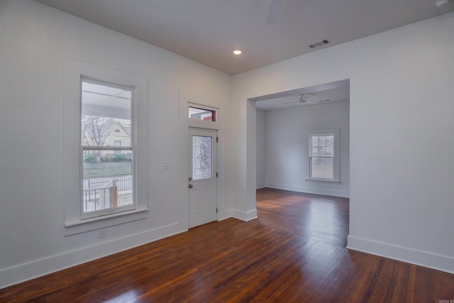 entryway with dark wood-type flooring and ceiling fan