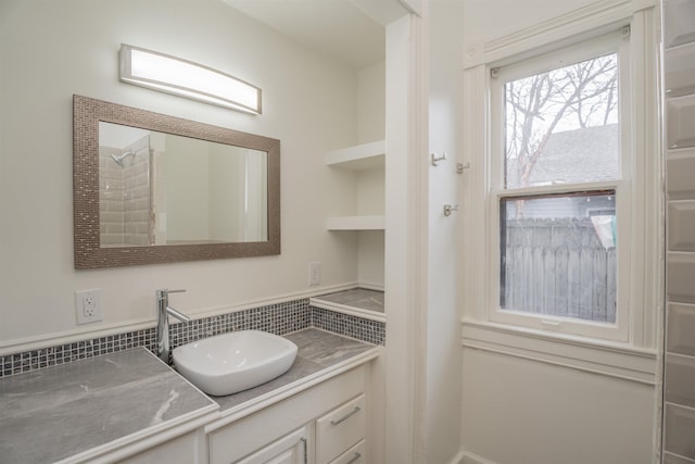 bathroom with vanity and backsplash