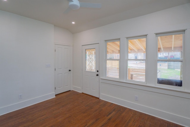 unfurnished room with lofted ceiling, dark wood-type flooring, and ceiling fan