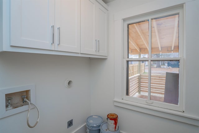 clothes washing area with cabinets, electric dryer hookup, and hookup for a washing machine