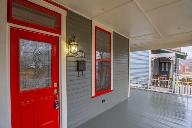 doorway to property featuring covered porch