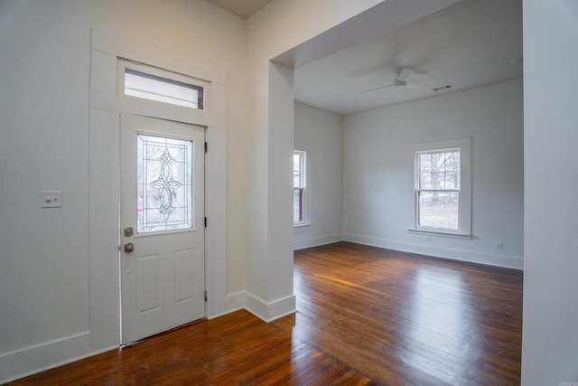 entryway featuring ceiling fan, plenty of natural light, and dark hardwood / wood-style flooring