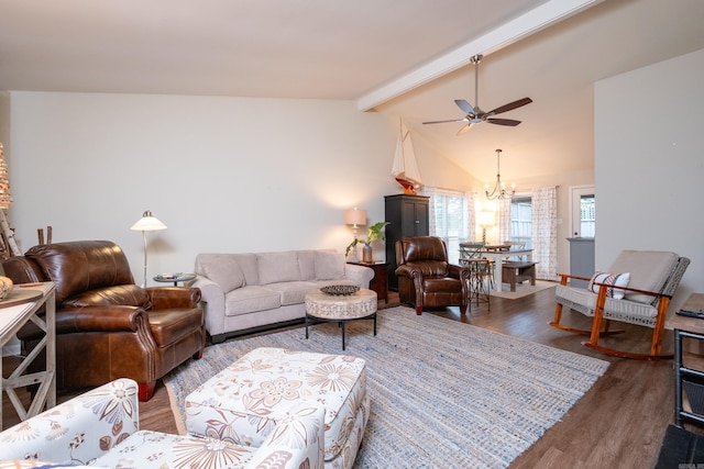 living room with dark hardwood / wood-style floors, ceiling fan with notable chandelier, and vaulted ceiling with beams