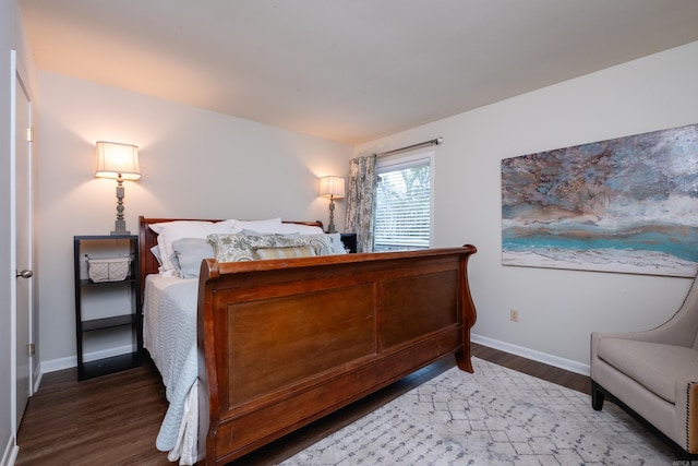 bedroom featuring dark wood-type flooring