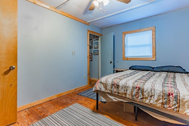 bedroom with hardwood / wood-style flooring and ceiling fan